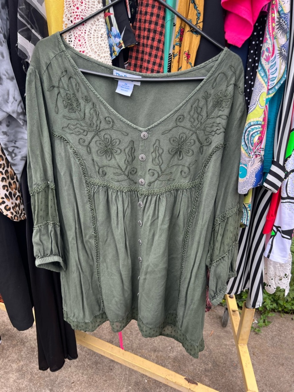 Dark green top with floral designs
